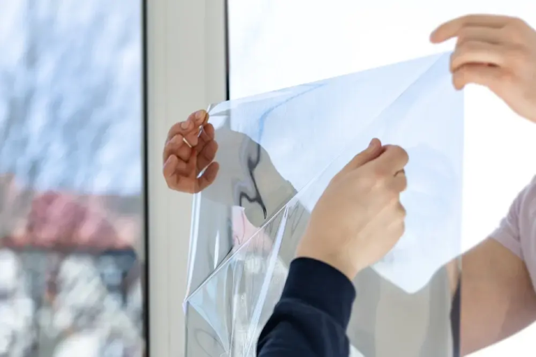 Experts applying window films.