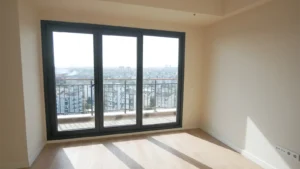 A wall of floor-to-ceiling windows with residential window film