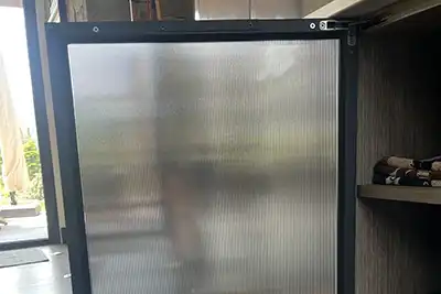 a cabinet door has textured window film